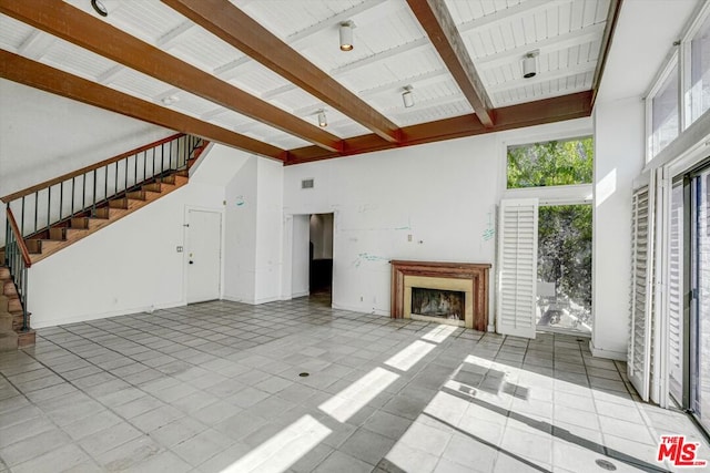 unfurnished living room with high vaulted ceiling, wooden ceiling, and beamed ceiling