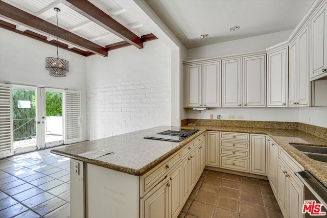 kitchen with pendant lighting, beamed ceiling, kitchen peninsula, light stone counters, and stainless steel dishwasher