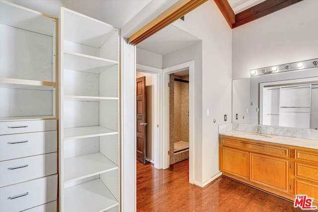 bathroom featuring hardwood / wood-style flooring and vanity