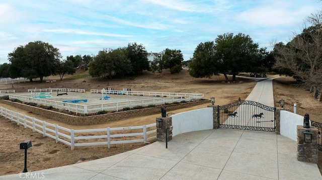 view of pool with a rural view