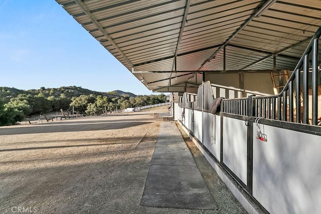 view of stable featuring a mountain view