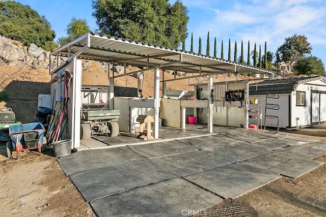 view of patio / terrace featuring a storage shed