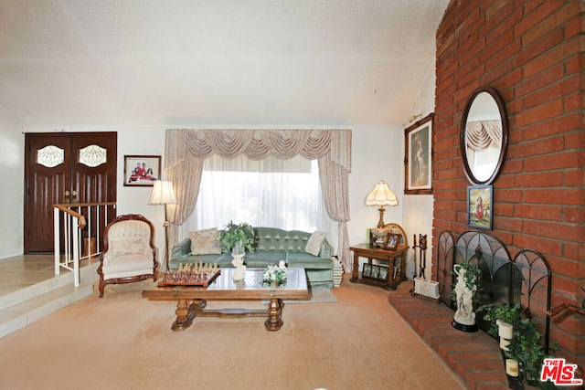 living room with carpet and lofted ceiling