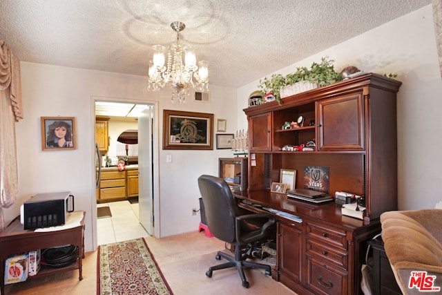 tiled home office featuring a textured ceiling and a notable chandelier