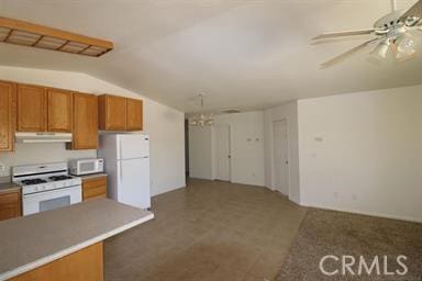 kitchen with ceiling fan, white appliances, and vaulted ceiling