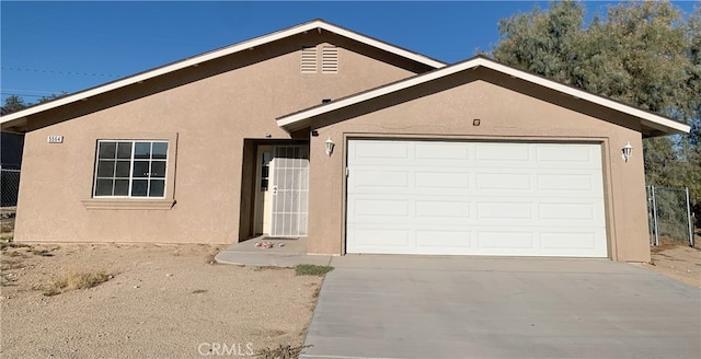 ranch-style house featuring a garage