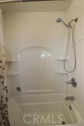 bathroom with shower / tub combination