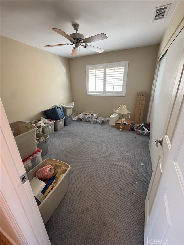 miscellaneous room featuring ceiling fan and carpet