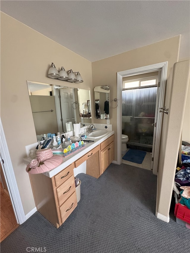 bathroom featuring toilet and vanity