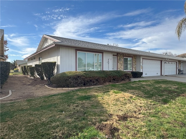 ranch-style home with a garage and a front yard