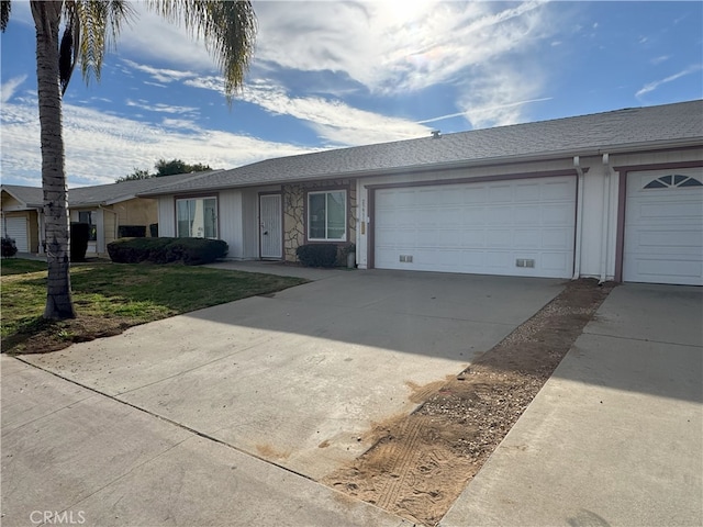 ranch-style house featuring a garage