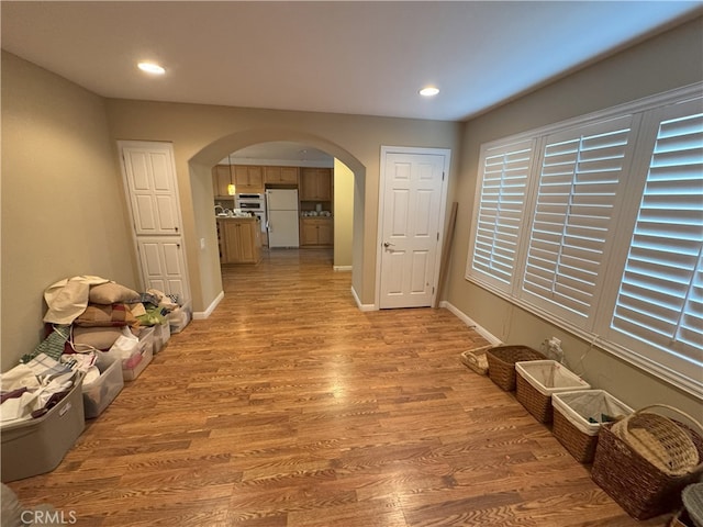 corridor featuring light hardwood / wood-style floors