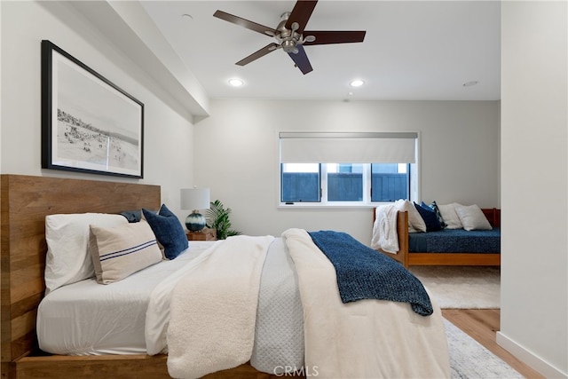 bedroom featuring ceiling fan and wood-type flooring