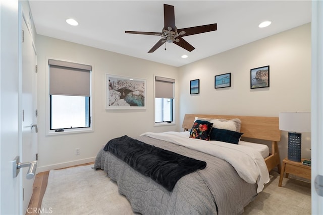 bedroom featuring ceiling fan and light hardwood / wood-style floors