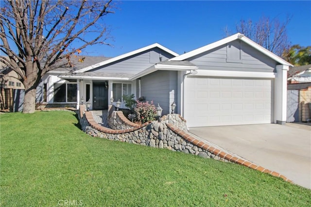 ranch-style house featuring a front lawn and a garage