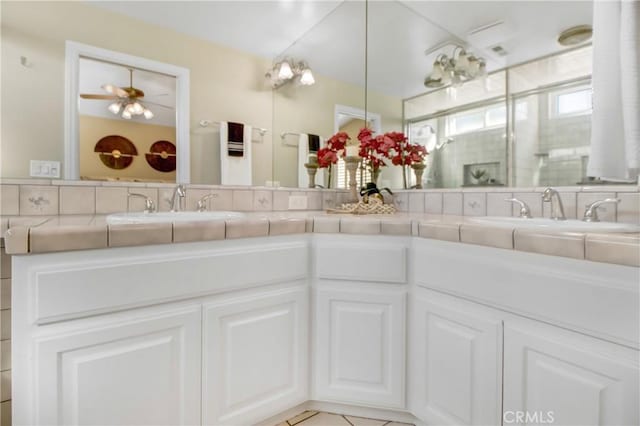 bathroom featuring ceiling fan and vanity