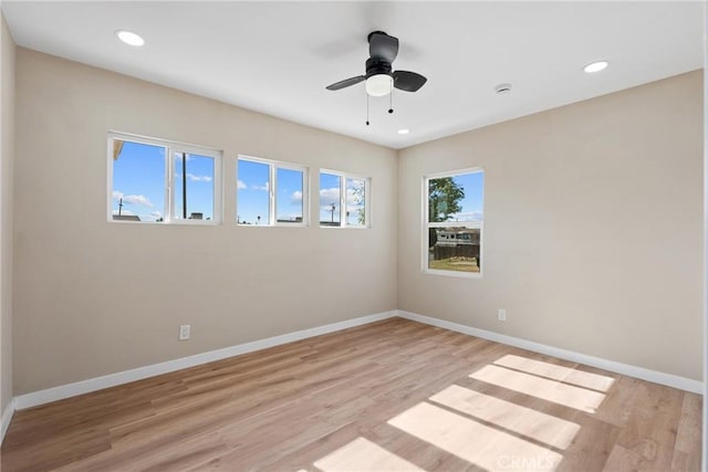 unfurnished room featuring ceiling fan and light hardwood / wood-style flooring