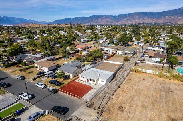 birds eye view of property with a mountain view