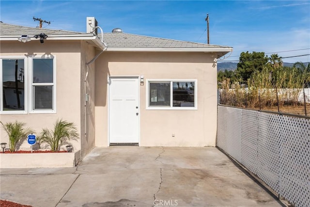 entrance to property with a patio