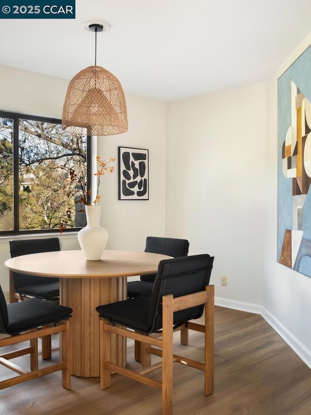 dining room with dark wood-type flooring