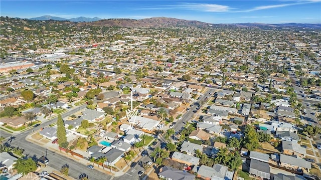 birds eye view of property with a mountain view