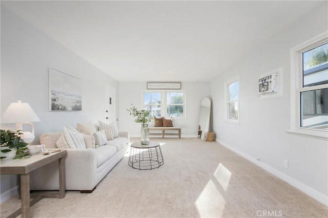 carpeted living room with a wall unit AC