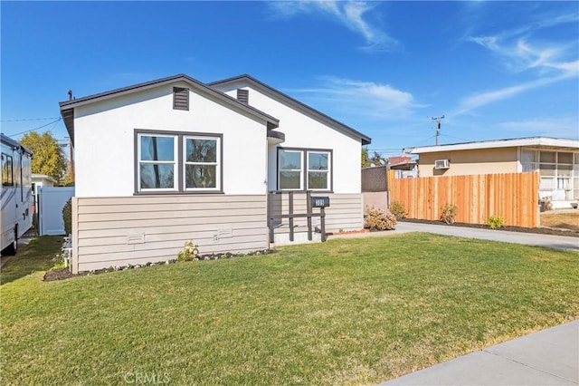 rear view of house with a yard