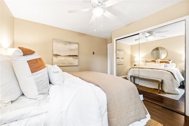 bedroom featuring ceiling fan, wood-type flooring, and a closet