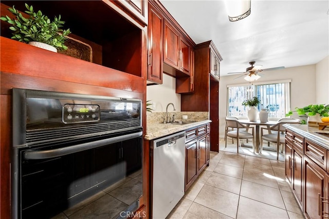 kitchen with ceiling fan, dishwasher, sink, light tile patterned flooring, and black oven