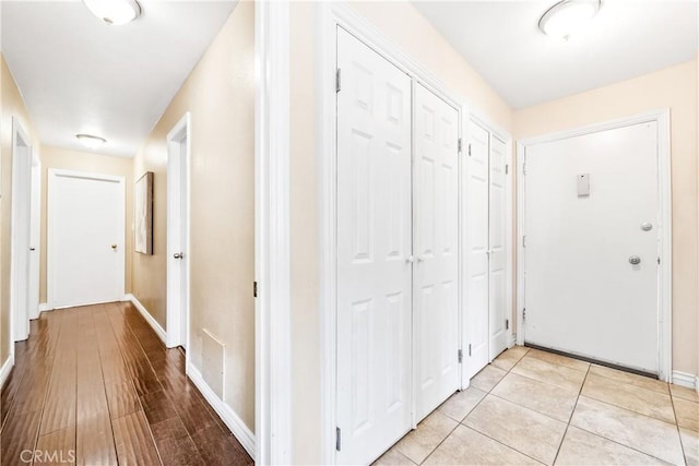 hallway with light wood-type flooring