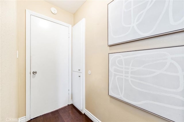 corridor with dark wood-type flooring