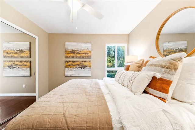 bedroom with ceiling fan and hardwood / wood-style floors