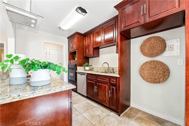 kitchen featuring dishwasher, sink, light stone counters, and oven