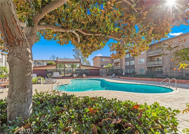 view of swimming pool with a patio