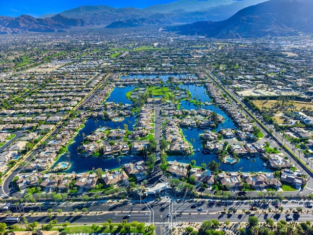 bird's eye view with a water and mountain view