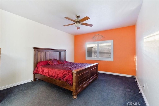 bedroom featuring ceiling fan and dark colored carpet