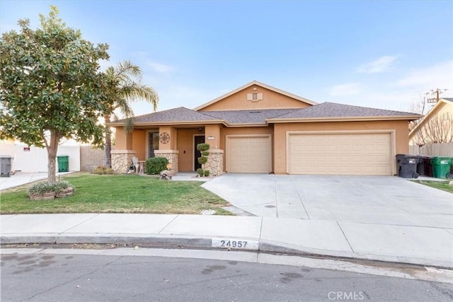 view of front of house with a front yard and a garage