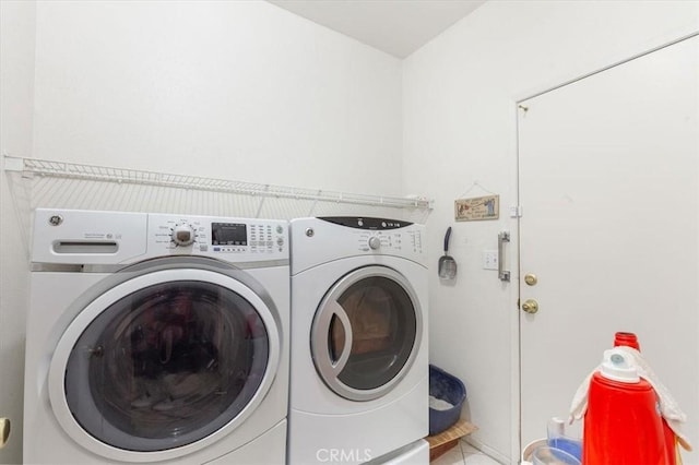 clothes washing area with washing machine and clothes dryer