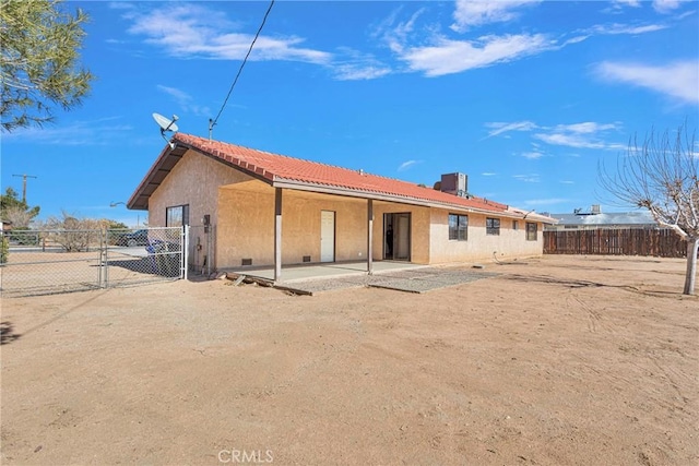 rear view of house featuring a patio area