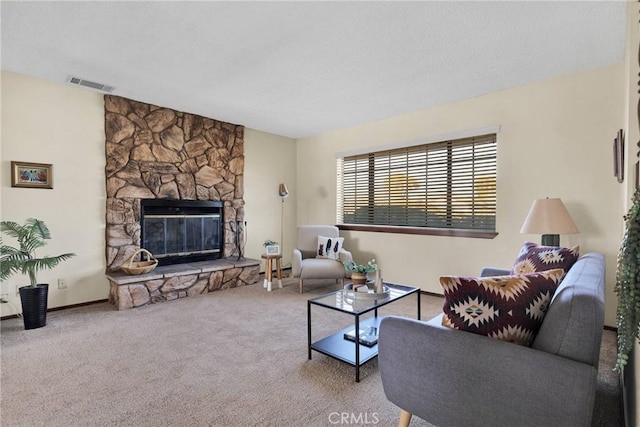 carpeted living room with a fireplace