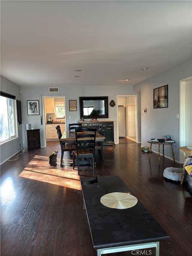 living room with dark hardwood / wood-style floors