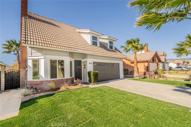 view of front of home with a garage and a front yard