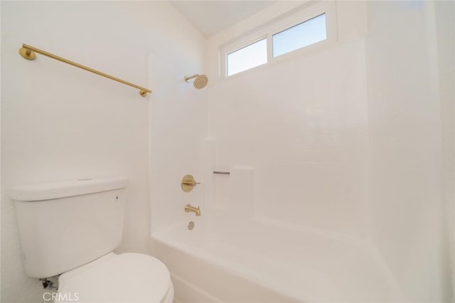 bathroom featuring toilet and shower / tub combination