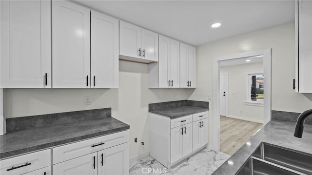 kitchen with white cabinets and sink