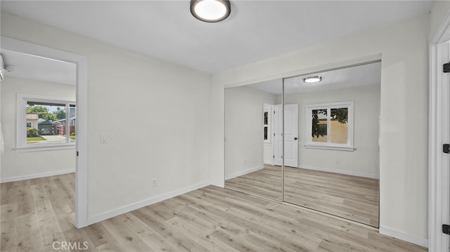 unfurnished room with light hardwood / wood-style floors