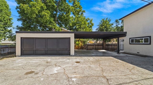 garage featuring a carport