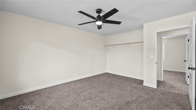 unfurnished bedroom featuring ceiling fan, a closet, and carpet