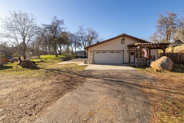 view of front facade with a garage and a pergola