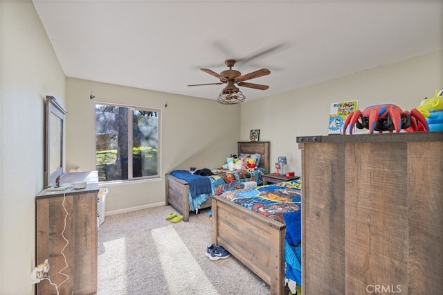 bedroom featuring ceiling fan and light carpet