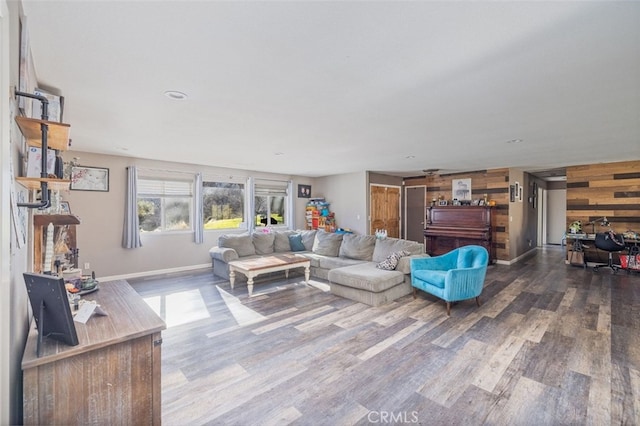 living room featuring wooden walls and hardwood / wood-style flooring